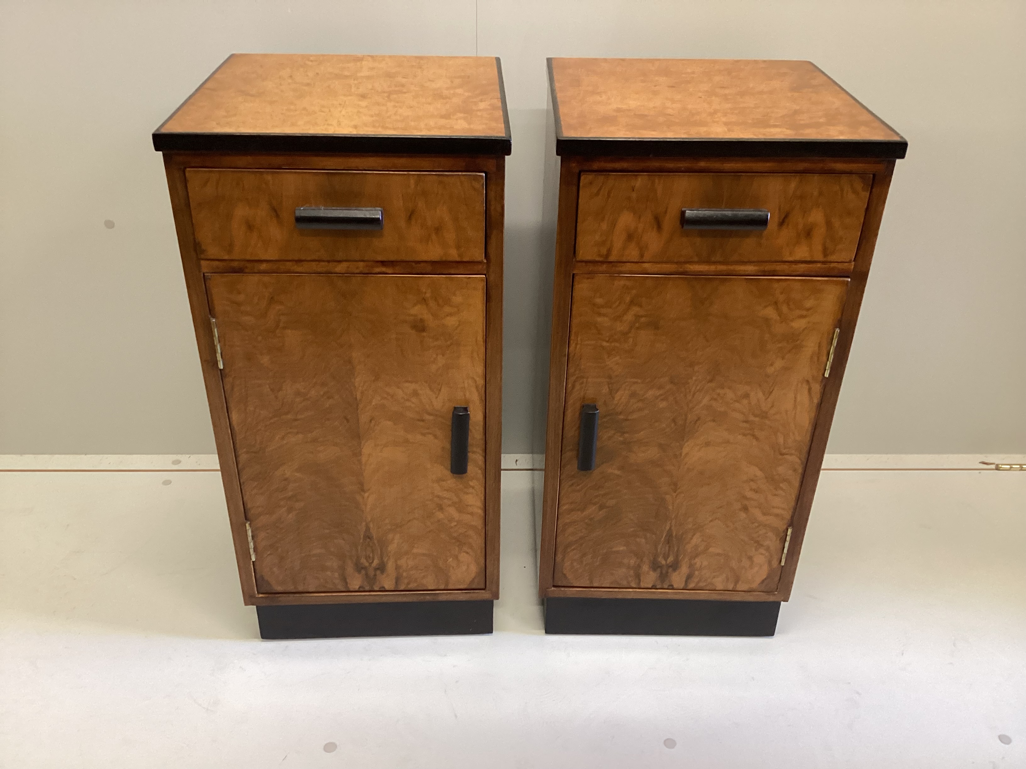 A pair of Art Deco style walnut and bird's eye maple bedside cabinets, width 36cm, depth 37cm, height 74cm